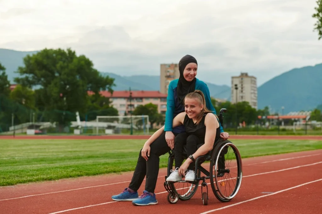 Two friends on running track together